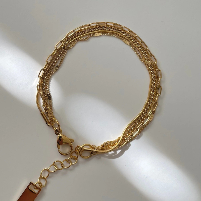 Four layer chain designs in one gold bracelet