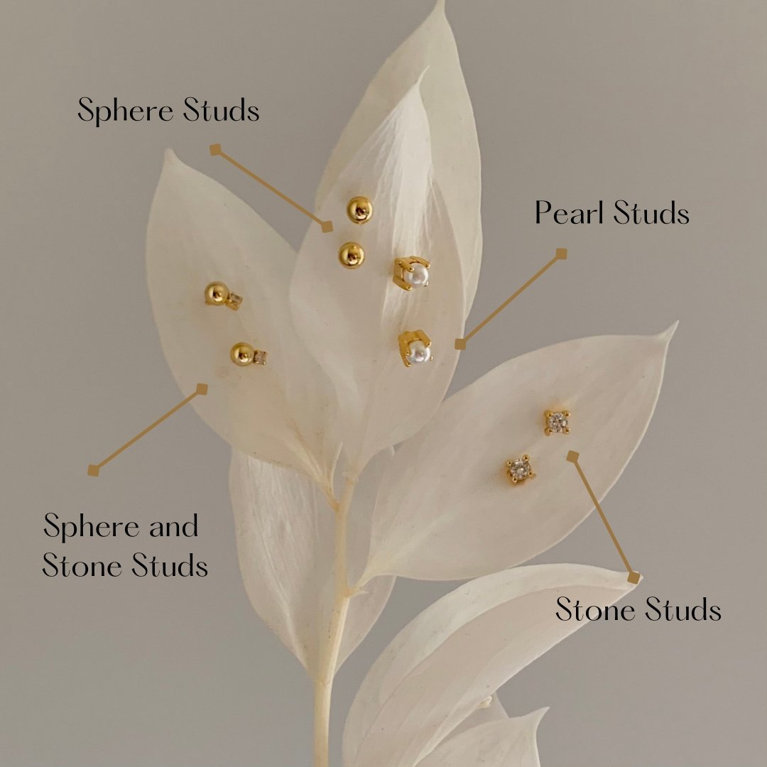 Gold stud earrings comparing different designs on a leafy background